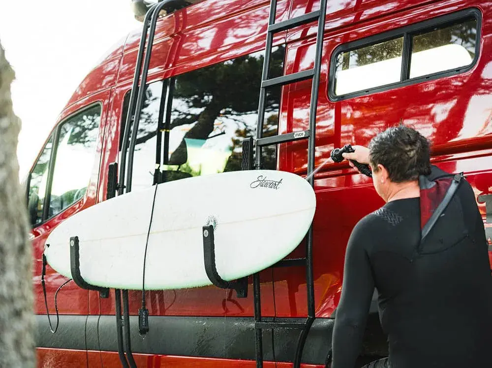 sprinter-van-surf-hooks-spray-surfboard.webp