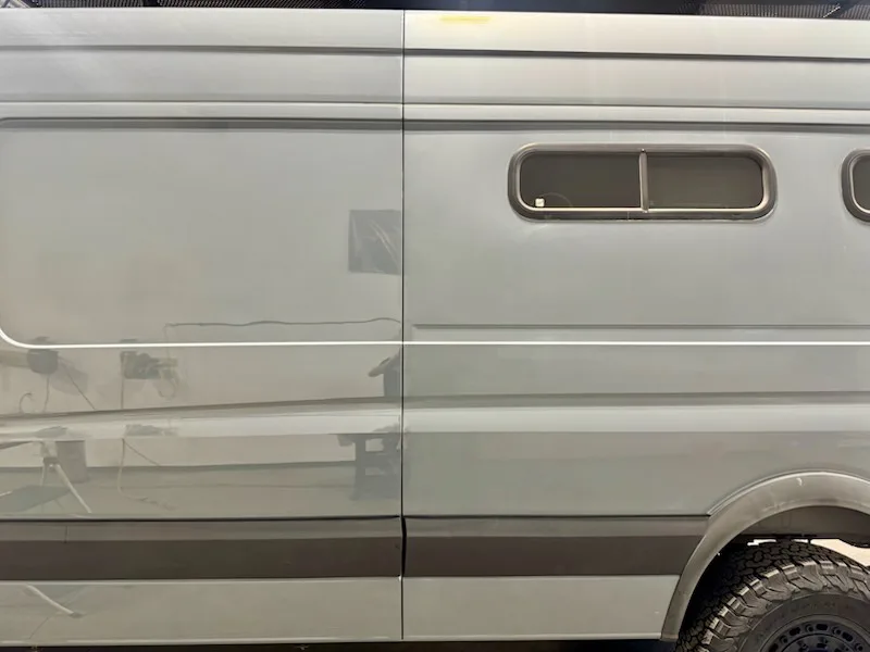 Close view of a grey Sprinter with corrected and uncorrected paint visible together